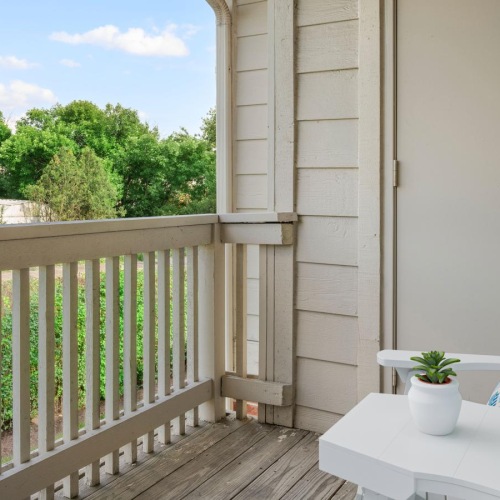 a patio with a table and chairs