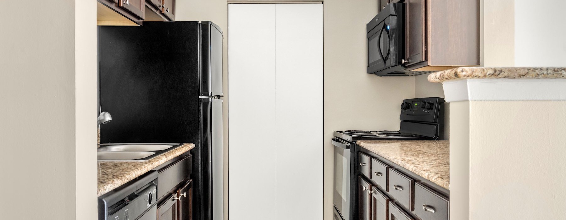 a kitchen with black appliances