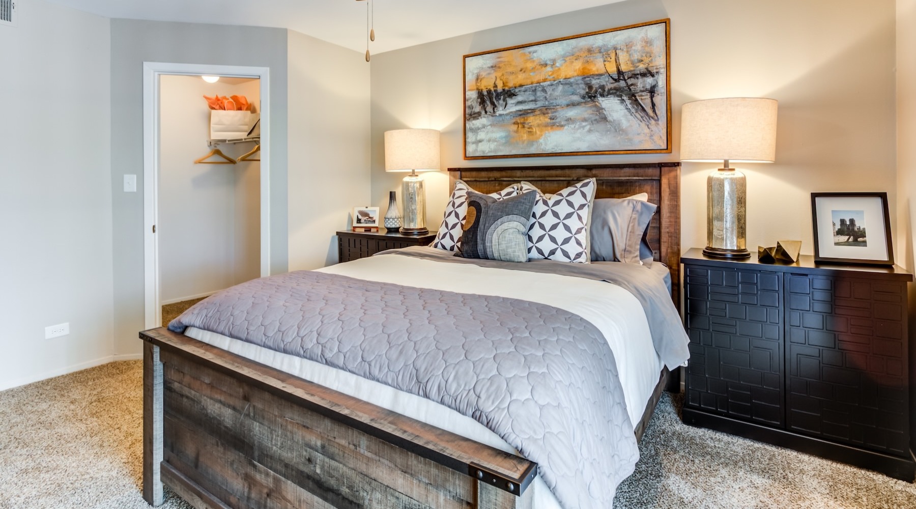 a bedroom with a bed and two nightstands