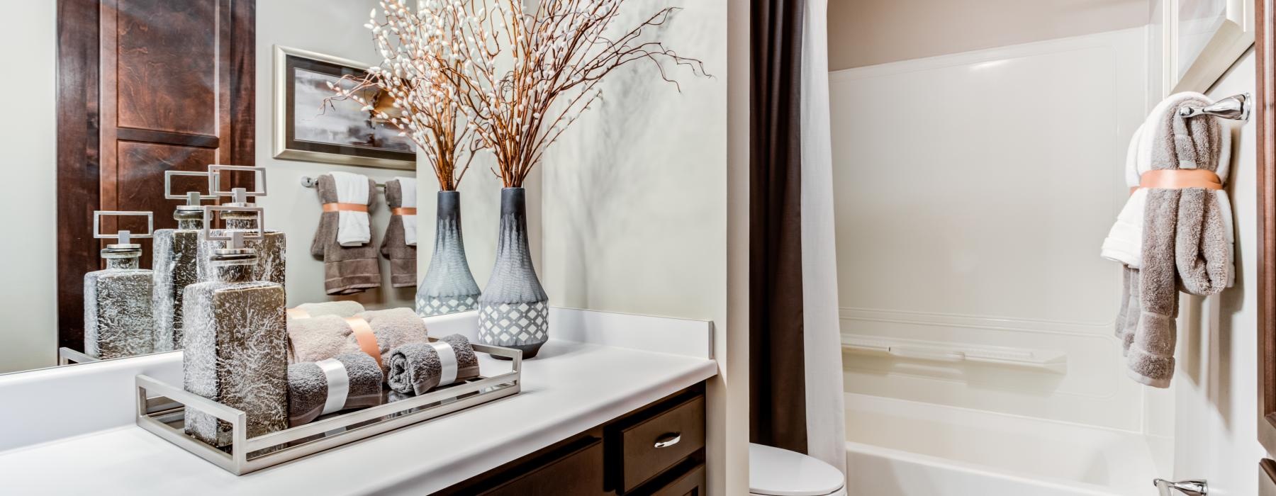 a bathroom with a shower, toilet and sink