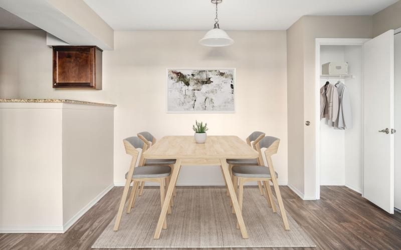 a dining room with a table and chairs