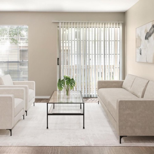 a living room with a couch and chairs